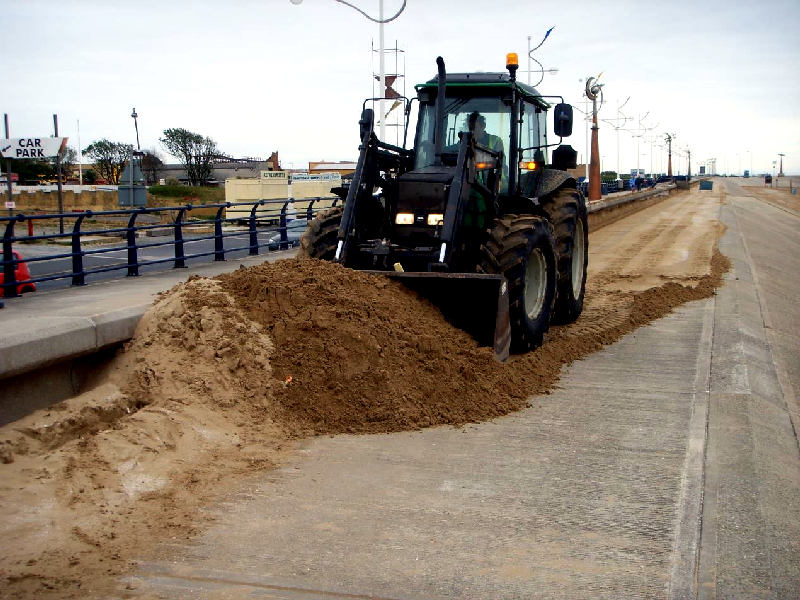 Southport tractor sand clearance in action.