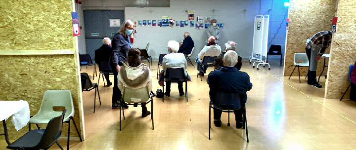 patients at Maghull Town Hall waiting to receive their vaccine.