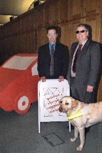 John Pugh MP, Iain McAndrew and guide dog.