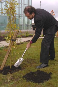 Bishop James Jones planting a tree in the Airport's Rainbow Garden of Remembrance