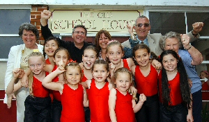 Volunteer Vera Keane, Trustee Father Karl Hart, CFM Grants Officer Tina Southern, Trustee Eddie Jackson and Volunteer Dolly Quinn with  girls from the Elite School of Dance, which is based in the Old Schoolhouse.