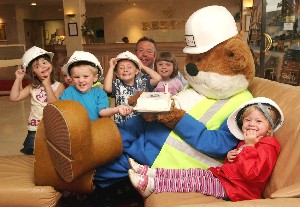 One today � Buster celebrates his birthday with Bob Sayers and the children from the �Busy Bees� day nursery.