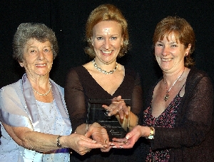 Thelma Smith and Margaret Davitt of Lyndale Knowsley Cancer Support Centre collect their award for Most Inspiration Group from Heather Summers of award sponsor JST Lawyers.