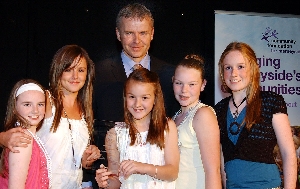 Performance Studio students Maria Donovan, Rebecca Woods, Chloe Harrison, Jenny Sealy and Lauren Maloney collect their award for Best Youth Group from Merseyside Fire and Rescue Service's Richie Davis.