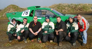 The photo shows (top left to right) Myerscough College Motorsports students Tom Hill and Matt Griffin, Course Tutor Pat Masters, students Richard Coates, Sam Rosamon and Peter Read and Course Tutor Stuart Ward with the RS 200. Also shown is the trophy the team won and the students working on the vehicle.