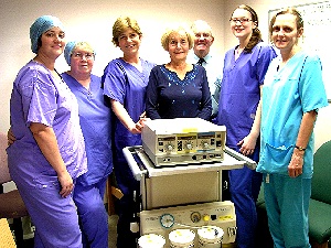 This pictures shows Audrey Stuart (centre) flanked by Ron Stuart and Penny Hipwell with other members of the theatre staff.