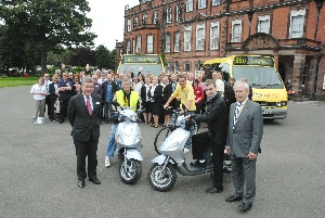 Pictured: Neil Scales (front left) and Councillor Bob Roberts (front right) of Merseytravel, with Scooters, Dial-A-Link buses and many of those involved in the Beacon projects.
