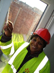 Liverpool mum of two Julia Walimbwa gets stuck into helping to build her own home.