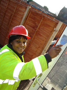 Liverpool mum of two Julia Walimbwa gets stuck into helping to build her own home.