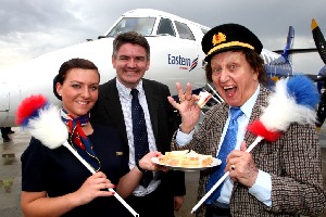 Louise Bradford, Eastern Airways Cabin attendant, with Neil Pakey, Deputy Chief Executive of Peel Airports are very much tickled as Eastern Airways first Liverpool services are given a �Captain� Ken Dodd  send off.