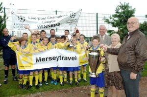 Chris Blakeley, Sandra Howard and Mark Dowd present the trophy to Liverpool Champions League winners Netherley Wood Lane Legion Under 13s.