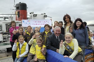Cllr Dowd (seated centre), Chair of Merseytravel, joins the Girl Guides mid-river.