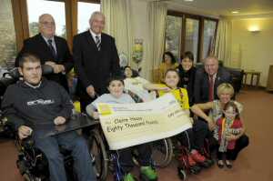 Merseytravel hand over the money to the children of Claire House