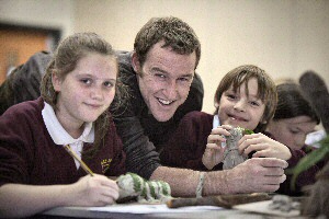 (from right) School pupils Emily Lester and Luke Hands with artist John Merrill  (centre)