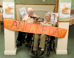 Pancake Racers, residents Doreen Stephenson and Ted Marks at the finish line