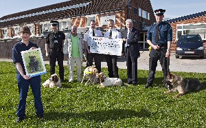Janine Ellett - Kennel Manager, Dog Section, Con Terry Welsh with PD Luke, Alan Briggs with Guide Dog Edie, Sgt Ian Murphy, Inspector Neil Davies - Head of Dog Section with PD Sadie, Paul Cooney - Merseyside & Wirral District Fundraiser for Guide Dogs and Con Phil Wright with PD Radar.