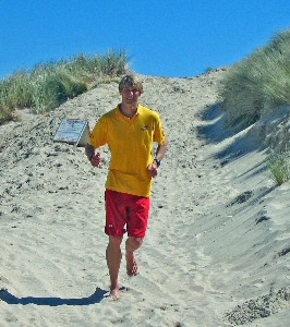 RNLI lifeguard Ollie Shilston training for the Summer Sprint (Credit RNLI/)