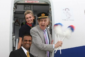 Cpt Mazher Nazir of Eastern Airways, Linzi Johnston, Eastern Airways Cabin Attendant with Ken Dodd at Liverpool John Lennon Airport