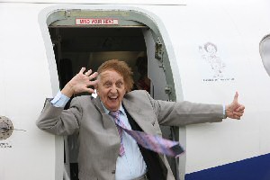 Ken Dodd unveils caricature on Eastern Airways aircraft fuselage at Liverpool John Lennon Airport