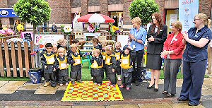 Children from Hopscotch Childcare unveil the Central BID Children’s Garden with toy donators Linda Hanninen (Clas Olsen), Stephanie Keir (Boots), Clayton Square & St Johns Marketing Manager Carol Cooper and Helen Bracewel (Mothercare).