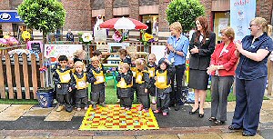 Children from Hopscotch Childcare unveil the Central BID Childrens Garden with toy donators Linda Hanninen (Clas Olsen), Stephanie Keir (Boots), Clayton Square & St Johns Marketing Manager Carol Cooper and Helen Bracewel (Mothercare).