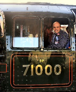 Hayden Fourtune, Yorkshire livestock farmer and charter train operator is pictured with restored steam locomotive 71000 Duke of Gloucester during a recent HF Railtours charter. Perceptive Images