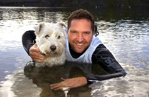 TESTING THE WATERS: Peter Emmett of Guide Dogs takes to the water with faithful pooch, Digger.