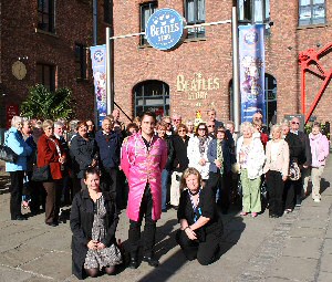 The group visiting the Beatles Story in the Albert Dock with Janine Ross of the Mersey Partnership and Charlotte Martin of the Beatle Story left to right in the foreground.