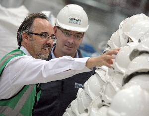 Peter Ball (left) and Brian Handcock (right) take a closer look at the hard hats to be recycled.