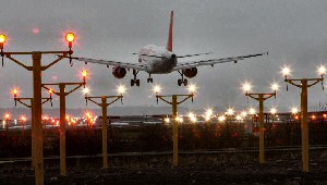 The new approach lights for runway 27 at Liverpool John Lennon Airport help to guide another arriving aircraft onto the runway.