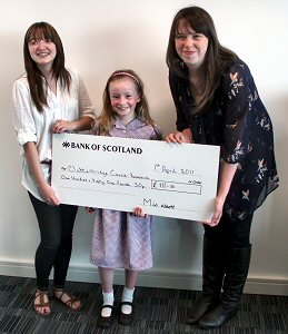 Mia with Jo Parry (right) and Laura McMullin from Clatterbridge Cancer Research