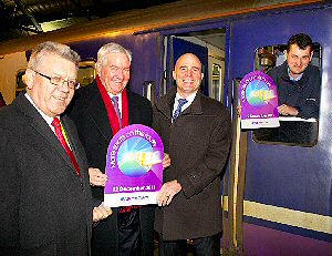 Neil Scales, Mark Dowd of Merseytravel and Lee Wasnidge of Northern Rail celebrate the departure with driver Adam Owen-Smith.