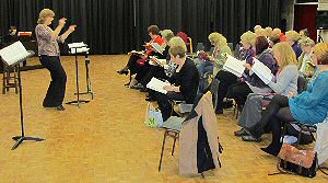 Isobel Jenkins conducting the Come and Sing chorus.