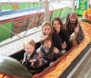 L to R sons Blake (3), Toby (5), Mum Vikki Higham (from Lydiate, who works in HR for Merseyside Police) and their cousin Sasha Eccles. Mum entered a competition and won a VIP day at Southport New Pleasureland, a role in today�s launch and a family ticket for Blue Planet Aquarium. Pictured with the family is Blue Planet�s 'Jack Sparrow'.