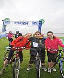 Riders celebrate after completing the Manchester to Liverpool bike Ride.l