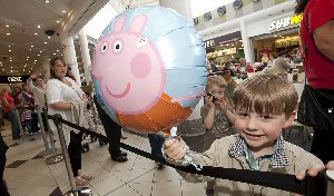 Zackary Sheridan, 4, from Prenton, waits patiently in the queue for his turn.