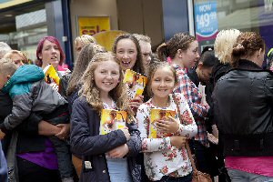 Waiting in the queue to meet the tabloid superstar are Elen Caddick, Ellie Christie and Saskia Bradley.