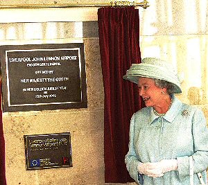 The Queen with the plaque she unveiled at Liverpool John Lennon Airport.