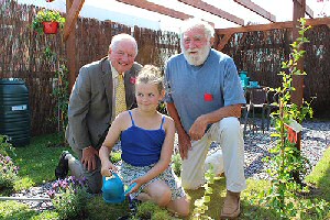 Peter Hosker and David Bellamy are pictured with Jessica in her winning garden.