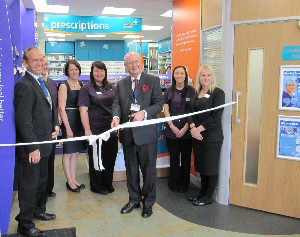 Picture shows Trust chairman Sir Ron Watson CBE officially opening Rowlands Pharmacy at Southport hospital with Trust Chief Pharmacist Adrian Brown, left.