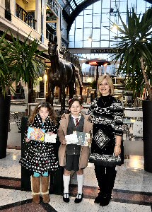Yvonne Burns, Wayfarers Shopping Arcade Manager, with the 2 lucky winners of the 12 days of Christmas competition.