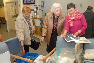 Artist Sian Hughes (on right) helping visitors to the Radiology department with their Cyanotypes