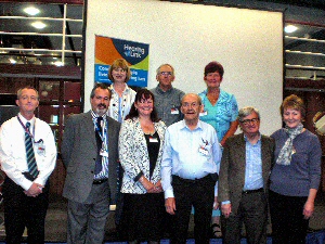 L-R (Bottom Row) - Gary Pick (Careline, Liverpool Direct Ltd); Tony Kay (Head of Audiology Services, Aintree University Hospital, NHS Foundation Trust);? Michelle McMaster (Hearing Link), Stan McCann (Chairman, The North West Federation) Eric Morris (President, The North West Federation) and Julie Leggett (Hearing Link).Top row - Dr Lorraine Gailey (Hearing Link Chief Executive); Graham Maher (Project Leader, Hear Here) Carol Riley (ATLA).