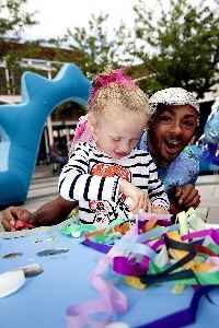 Pictured is Matilda Lawson making sea creatures with Stuart Bowden.