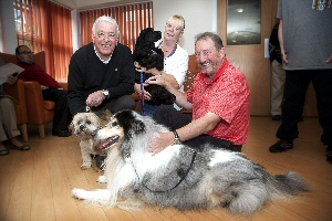 Pictured is Ian Callahan with the winning dog, Oscar, Kath Roberts, Daycare Manager with the runner up ,Penny and Jim Donaldson, Chairman of Childrens charity Variety with Nelson who took third place.