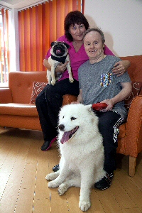 Pictured is Staff member Rachel Jones and resident Derek Jones with Benson and Daisy the dogs who took part in the show.