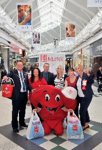 Pictured with the British Heart Foundation Mascot 'Hearty' are L-R Deputy Mayor Steve Foulkes, Jacqui Webb (BHF Area Manager), Derek Miller (Commercial Director for Pyramids Shopping Centre), Diane Wright, Lindsay Hodson (Manager BHF) and Deputy Mayoress Elaine Nolan.