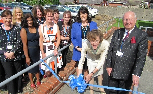  Dame Carol Black cutting the ribbon to open the centre, with Trust chairman Sir Ron Watson CBE