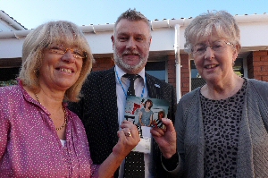 Trust chief executive Jonathan Parry with Mavis Ferguson, left, and Chris Davies holding a picture of themselves working at PACE in the late Eighties