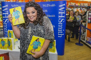 Excited fans wait to meet Lisa Riley at the start of the signing at WH Smith in Pyramids Shopping Centre.